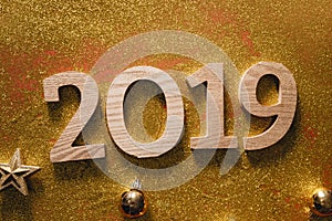 Happy New Year`s layout. numbers 2019 notepad and free space for text. Christmas decorations, xmas toys, gold stars, gifts