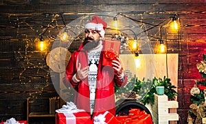 Happy new year. Santa Claus gifting gift. Hipster santa claus. Santa in home. Merry christmas and Happy new year.