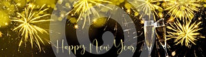 Happy New Year - Silvester background banner - Sparkling sparklers, golden yellow firework champagne glasses toast and bokeh