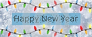Happy New Year - A snowflake background banner with multiple colour Christmas Tree lights