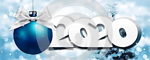 2020 Happy New Year text with blue christmas ball and silver ribbon bow isolated on blurred lights  Background for Flyers and