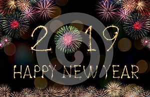 Happy New Year 2019 text hand written sparkles fireworks with Colorful fireworks of various colors at night