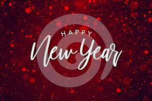 Happy New Year Text Over Red Sparkle Glitter Background. Magical Holiday Calligraphy Font with Glowing Defocused Bokeh Lights Back