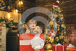 Happy new year. Winter delivery service for kids. Happy child with Christmas gift box. Cute little kids celebrating