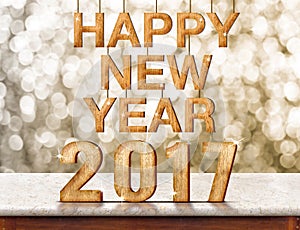 Happy New Year 2017 wood texture on marble table with sparkling