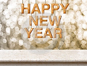 Happy New Year wood texture on marble table with sparkling bokeh wall,Holiday concept