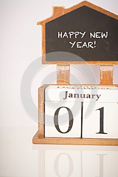 Happy New Year: Wooden block calendar showing 1st January