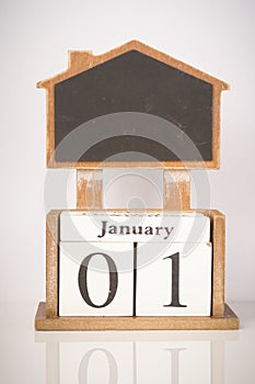 Happy New Year: Wooden block calendar showing 1st January