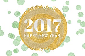 Happy new year 2017 word on gold circle glitter on light green