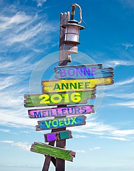 2016 happy new year written in French on a postsign photo