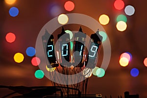 Happy new year is written with a lamp light. Radio electronic lamps. 2019. Original designed congratulation with a