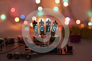 Happy new year is written with a lamp light. Radio electronic lamps. 2018. Original designed congratulation with a