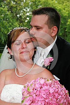 Happy newlywed couple kissing