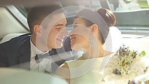 Happy Newlyweds Having Fun in a Limo