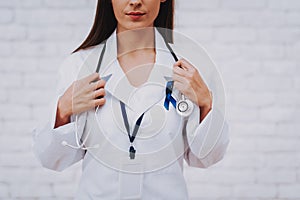 Happy Nurse in Bathrobe with Patient in Clinic.