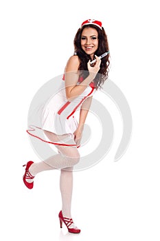 Happy nurse holding a syringe