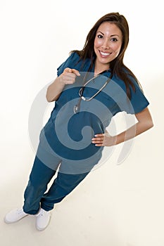 Happy nurse pointing