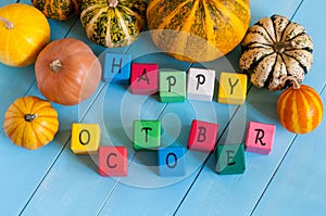 Happy October wooden blocks with many-coloured