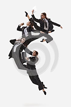 Happy office worker doing office work and dancing in classic clothes isolated on white. Ballet dancers. Business, office