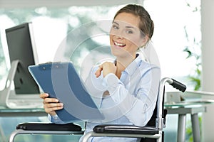 happy office worker in wheelchair