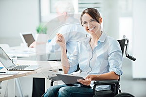 Happy office worker in wheelchair