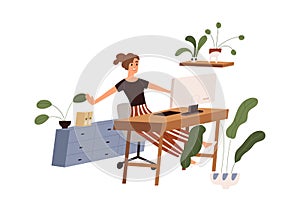 Happy office worker at workplace, finishing her work with computer. Woman stretching at table at end of workday photo