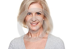 Happy old blonde woman smiling. Isolated