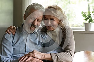 Happy old couple enjoy maturity together at home