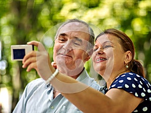 Happy old couple with flower