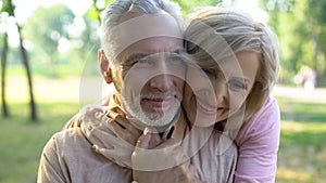 Happy old couple hugging, resting in park together, grandparents closeness photo