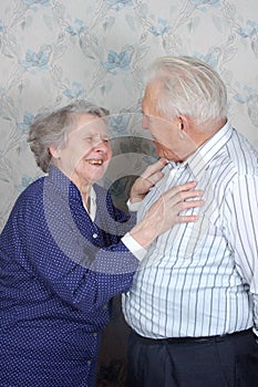 Happy old couple laugh