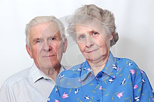 Happy old couple looking to the camera