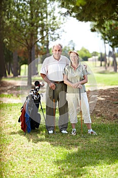 Happy old couple, portrait or golfers on course in fitness workout, exercise or round together on field. Embrace