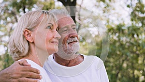 Happy old couple relax in the park