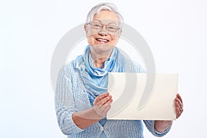 Happy old lady with blank sheet