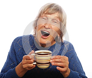 Happy old lady with coffee