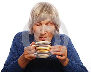 Happy old lady with coffee