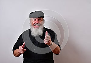 Happy old man is laughing and pointing