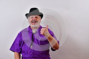 Happy old man smiling with one thumb pointing up