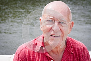 Happy Old Man by Water