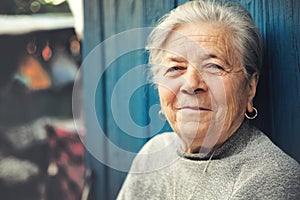 Happy old senior woman smiling outdoor