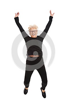 Happy old woman jumping.