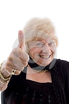 Happy old woman showing thumb up