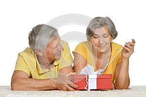 Happy older couple with gift