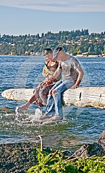 Happy Older Couple Splashing Feet in Water