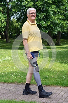 Happy older man walking with prosthetic leg