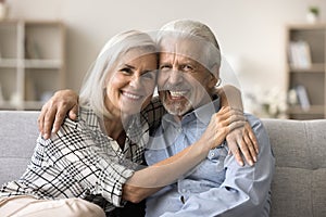 Happy older retired couple in love posing for family portrait