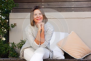 Happy older woman relaxing outside