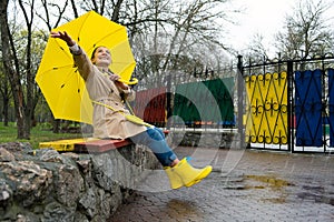 Happy older women having fun outdoor. Senior cheerful mature elderly retired woman with yellow umbrella enjoying life at