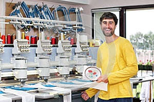 Happy operator of automatic embroidery machines